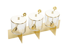 Load image into Gallery viewer, Three Glass Canister Set White Lids Gold Block Base